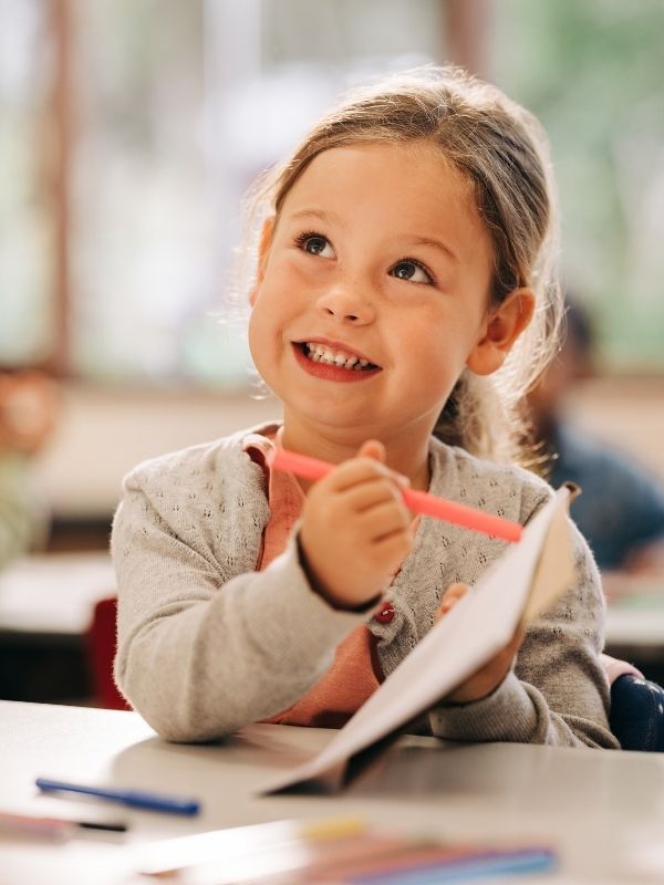 A child showing off their hard work.