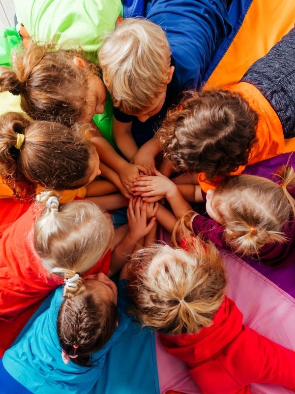 Children coming together for an activity.