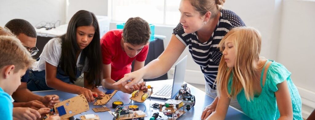 Students working on a robot build during an after school program. 